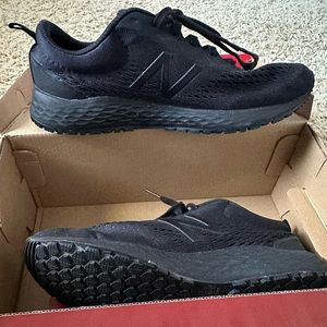 Work shoes by New Balance, slip resistant.